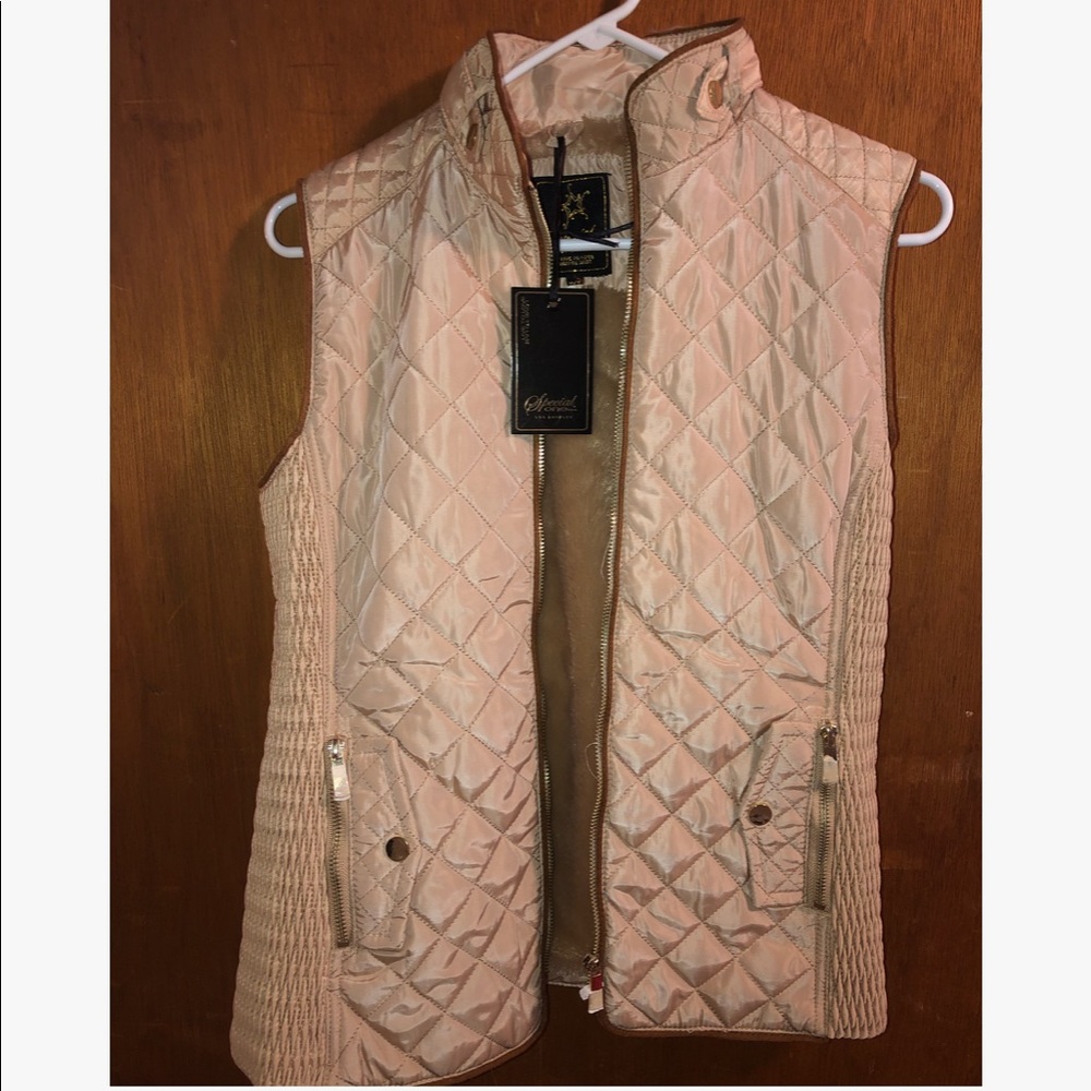 NEVER WORN VEST